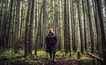 woman standing in forest at cumberland