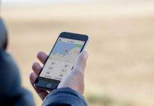 a guy using the Barnacle app on his iPhone