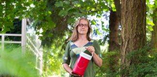 Civil engineering researcher Heather Buckley holds a container of wastewater samples on the way to the UVic lab for analysis, part of a project collecting, managing and reporting data from wastewater plants.