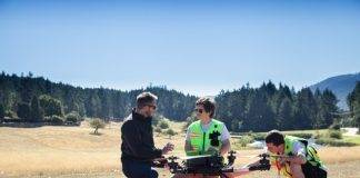 InDro Robotics CEO Philip Reece (left), together with an InDro pilot and technician, prep a drone flight to Penelakut Island.