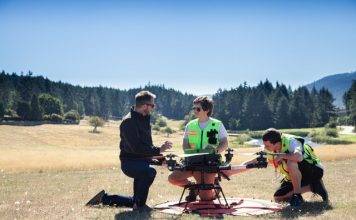 InDro Robotics CEO Philip Reece (left), together with an InDro pilot and technician, prep a drone flight to Penelakut Island.