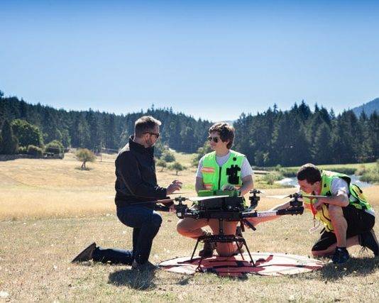 InDro Robotics CEO Philip Reece (left), together with an InDro pilot and technician, prep a drone flight to Penelakut Island.
