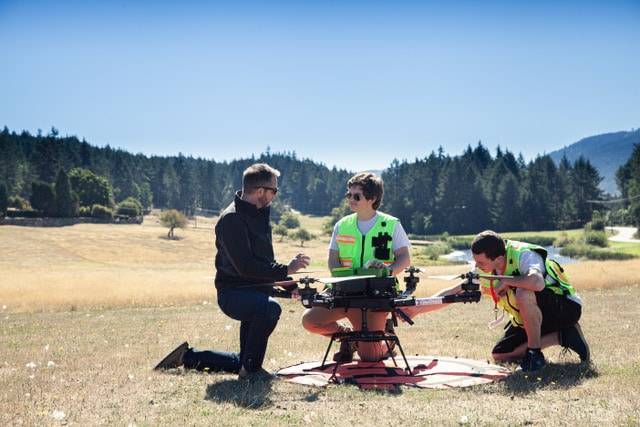 RogersInDro Main Photo InDro Robotics CEO Philip Reece (left), together with an InDro pilot and technician, prep a drone flight to Penelakut Island.