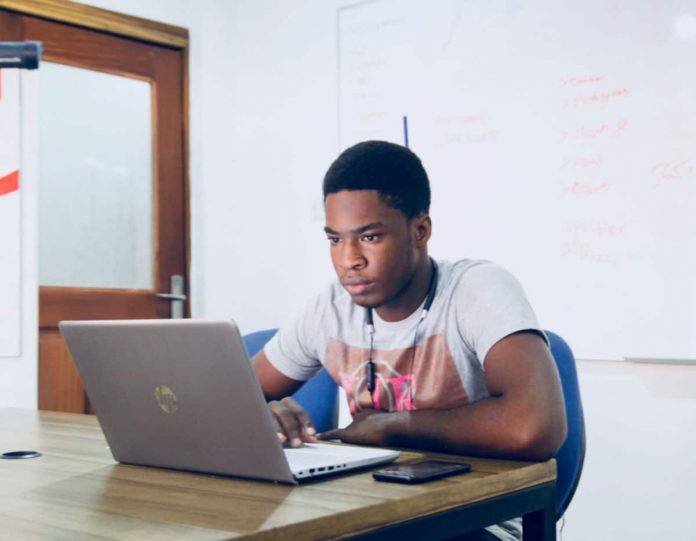 nesa-by-makers-7d4LREDSPyQ-unsplash (1) Man working on laptop