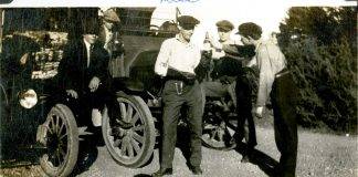 Workers at Hatley Park hand around a beer bottle