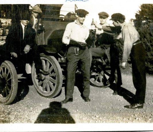 Workers at Hatley Park hand around a beer bottle