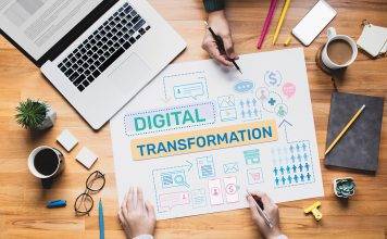 laptop and spreadsheet working on digital transformation