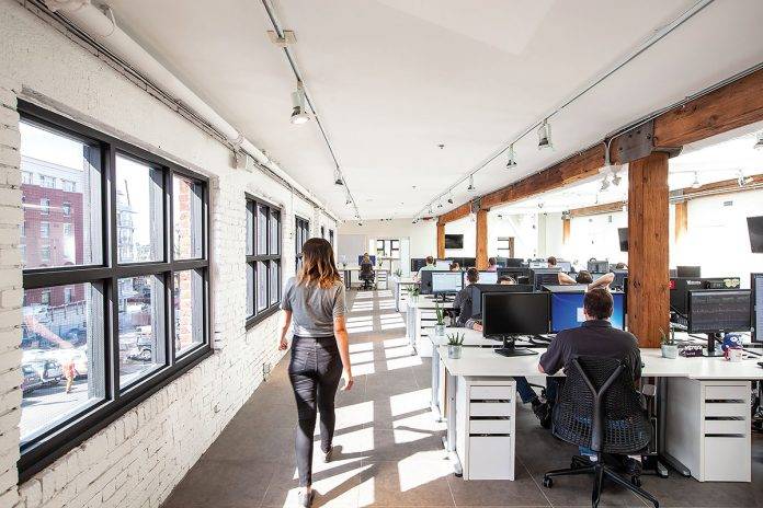 woman walking through an office