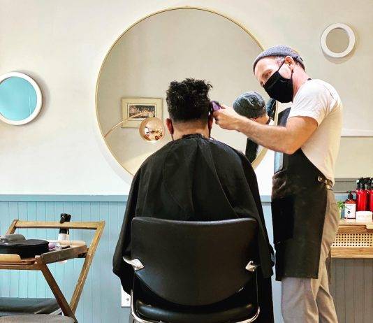 Jamie McCallum cutting hair