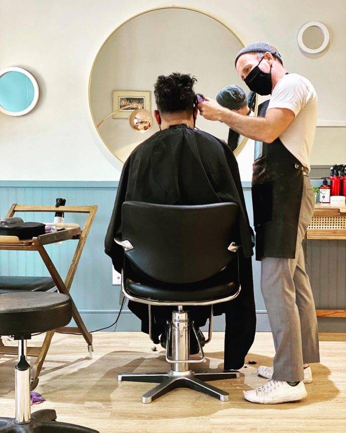 Jamie McCallum cutting hair