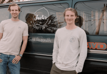 The Justos team standing by their van.