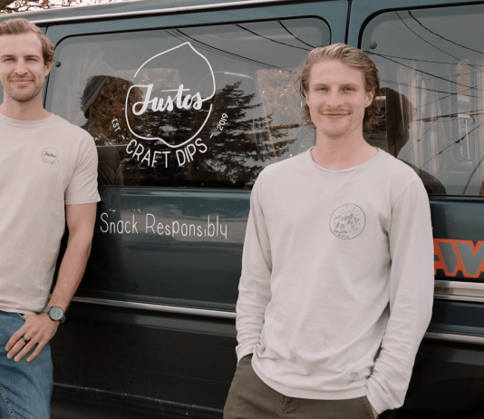 The Justos team standing by their van.