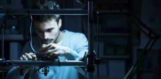 young male engineer working in lab