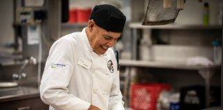 Indigenous student preparing food in the kitchen at Camosun College.