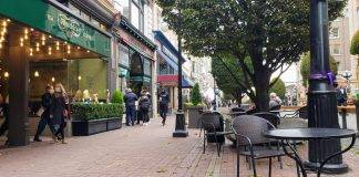 Shoppers browse stores on Government Street in downtown Victoria BC