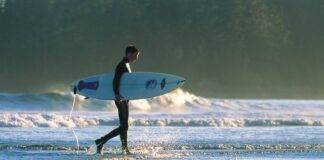 Surfing on Long Beach in Pacific Rim National Park. Photo credit: Destination BC/JF Bergeron.