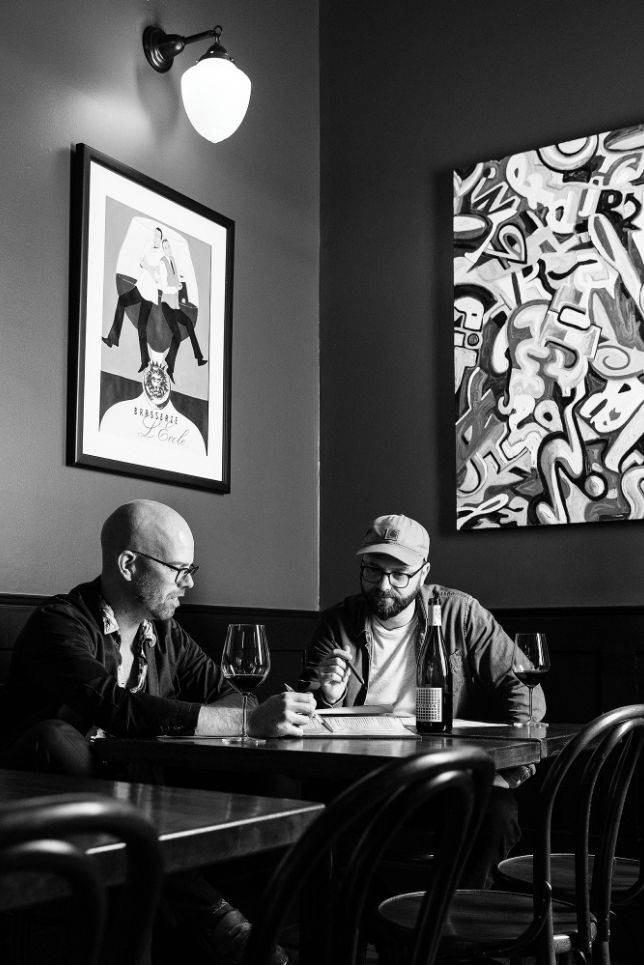 Vinuel Restaurant Group seated at a restaurant table.