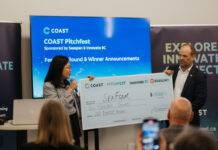 Jason Goldsworthy, Executive Director of COAST, presents SeaFoam co-founder Amy Yang with the $10,000 prize for COAST Pitchfest 2025. Photo credit: COAST/Megan Wilson.
