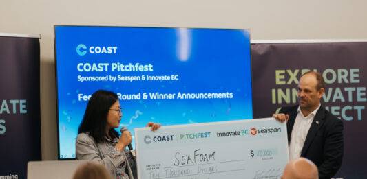 Douglas Weekly – October 30 Jason Goldsworthy, Executive Director of COAST, presents SeaFoam co-founder Amy Yang with the $10,000 prize for COAST Pitchfest 2025. Photo credit: COAST/Megan Wilson.