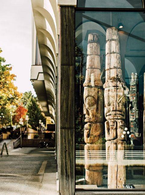 Wooden totem poles displayed in Victoria BC