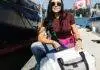 From Sails to Satchels Meaghan McDonald with Salt Legacy bags by the water.