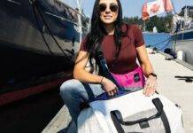 From Sails to Satchels Meaghan McDonald with Salt Legacy bags by the water.