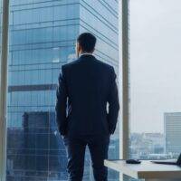 What Do You Value? Businessman gazing out window