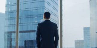 What Do You Value? Businessman gazing out window
