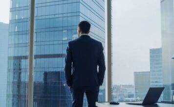 What Do You Value? Businessman gazing out window
