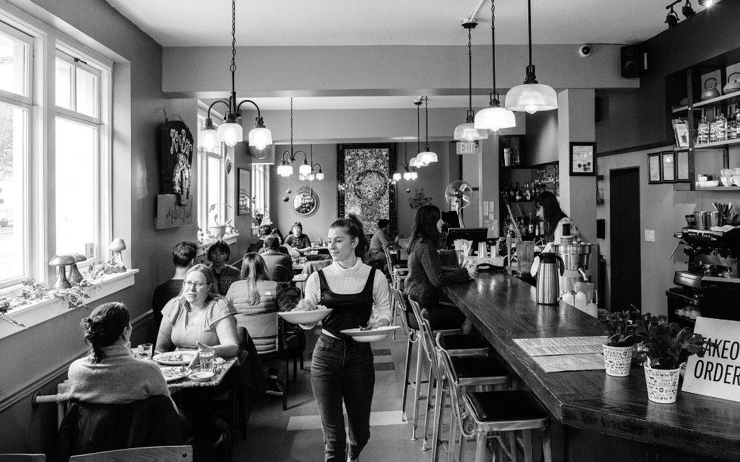 Busy Victoria restaurant with patrons dining inside.