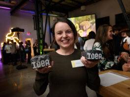 Emily Wilson, of A Light Studio and Man and Son Design, with their awards for Product Design and Ideated On the Island. Photo credit: Hélène Cyr/Design Victoria.