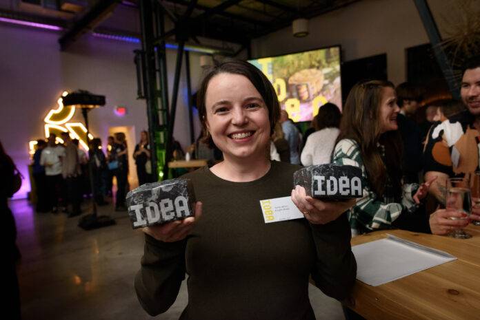 Emily Wilson, of A Light Studio and Man and Son Design, with their awards for Product Design and Ideated On the Island. Photo credit: Hélène Cyr/Design Victoria.