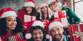 Group celebrating with Christmas gifts.