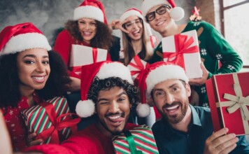 Group celebrating with Christmas gifts.