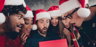 group of coworkers opening a gift