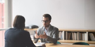 Business meeting with discussion at table.