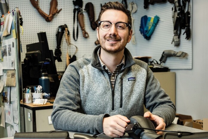 Michael Peirone working with prosthetic devices.