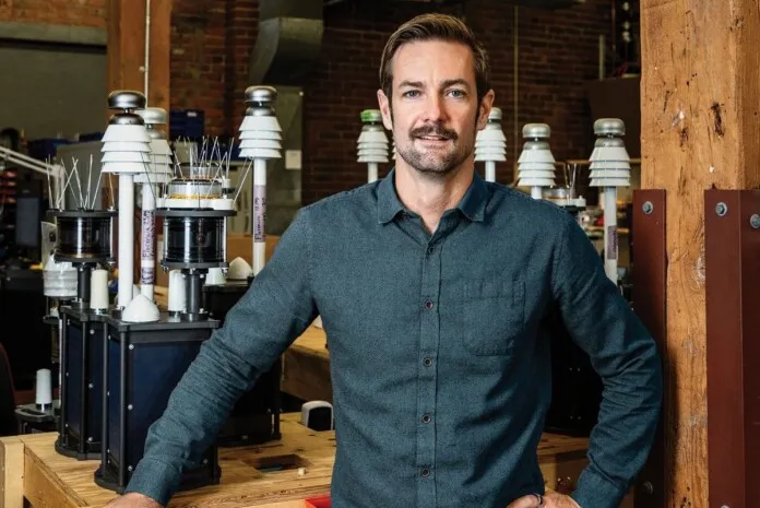 Scott Beatty with marine technology equipment background.